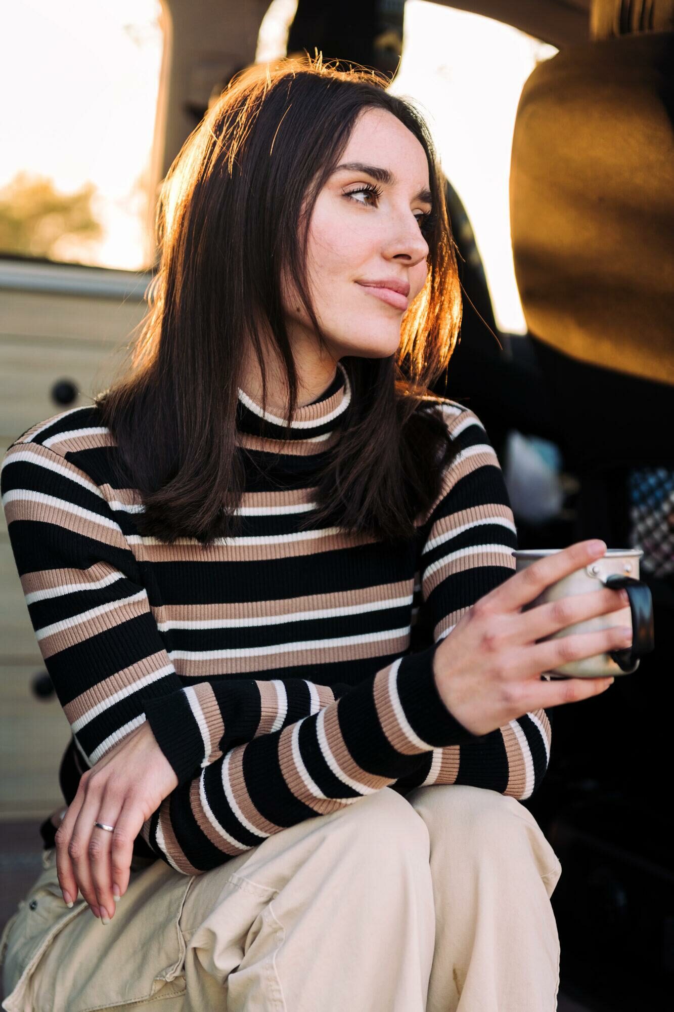 woman smiling happy drinking a cup of coffee