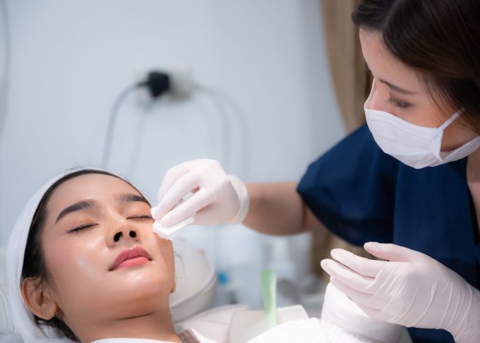 young woman patient with a therapy treatment of cosmetic face skin, surgery medicine concept